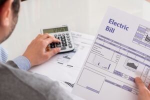 best-energy-practices-with-your-hvac - looking at bills